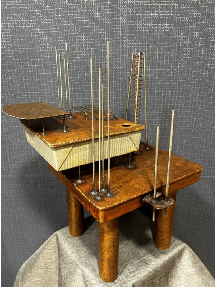 A wooden structure with many metal rodsDescription automatically generated with medium confidence